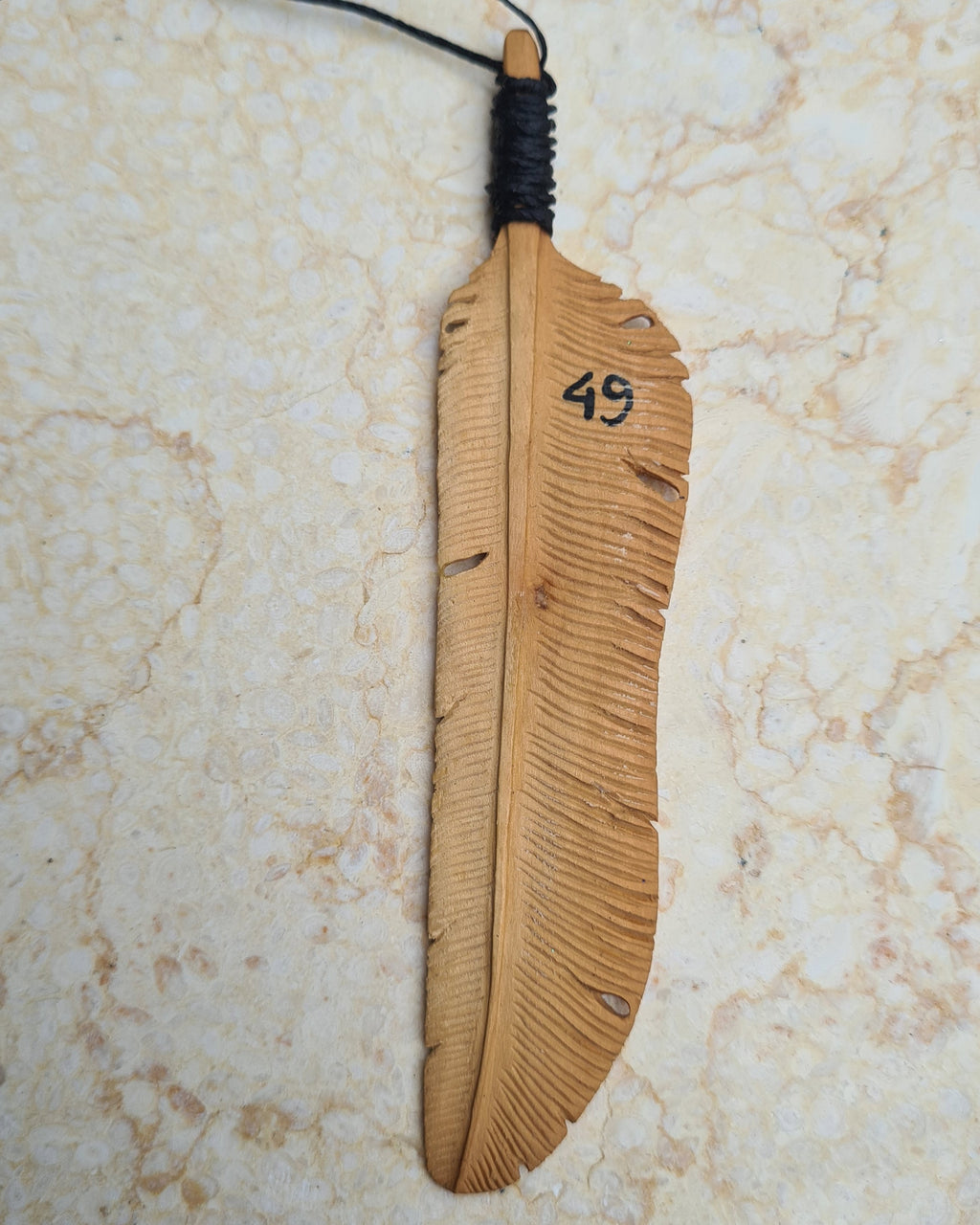 Limited Edition Tribe Flight Feather hand-carved out of Sandalwood, numbered on the back