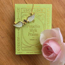 Load image into Gallery viewer, Feather Tribe&#39;s Angelica Pendant in Gold and Citrine on top of a Pistachio Mylk Praline Loco Love box
